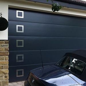 Low-Friction Sectional Garage Door for Hand-Operated Use in Remote Cabins